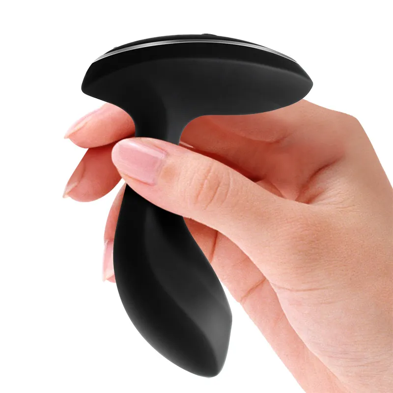 BoomPro electric shock butt plug held in hand, showcasing its compact and portable design for discreet and easy use.